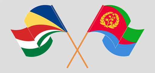 Crossed and waving flags of Seychelles and Eritrea