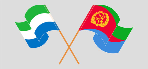 Crossed and waving flags of Sierra Leone and Eritrea