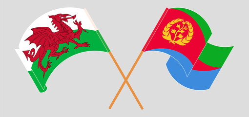 Crossed and waving flags of Wales and Eritrea