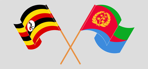Crossed and waving flags of Uganda and Eritrea