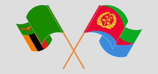 Crossed and waving flags of Zambia and Eritrea