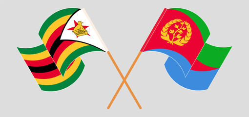 Crossed and waving flags of Zimbabwe and Eritrea