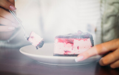 hands holding a cake