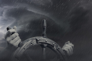 Steering hand wheel ship on sky background, hand hold hand wheel © alzay
