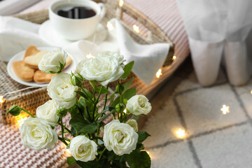 Bouquet of beautiful fresh roses in room, closeup