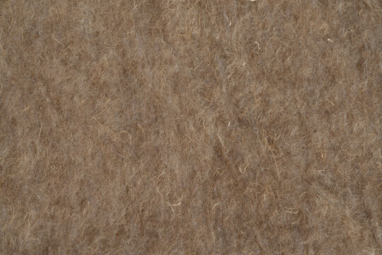 Soft insulating insulation for roofs made of hemp and linen close-up, top view, texture for background, thermal insulation, soundproofing