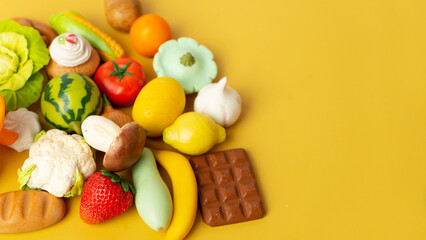 Fototapeta na wymiar Food vegetable, bread, fruit in eco grocery bag on yellow background, top view