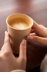 person holding a cup of coffee