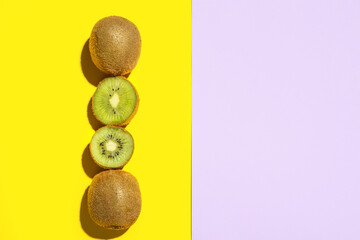 Fresh cut kiwi on color background