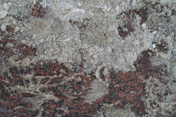 Above view of reagent or technical salt used for melting ice and snow on sidewalk in wintertime