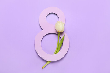 Composition with beautiful flower for International Women's Day on purple background