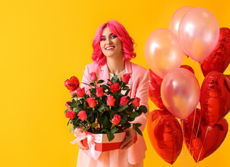 Stylish woman with bright hair, bouquet of flowers and air balloons on color background. Valentine's Day celebration