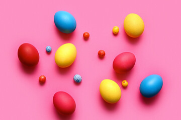 Multicolored Easter eggs on color background