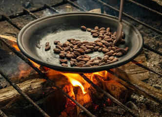 Cocoa beans toasted with firewood on a clay pan to make the traditional ancestral chocolate...