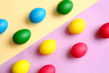 Multicolored Easter eggs on color background