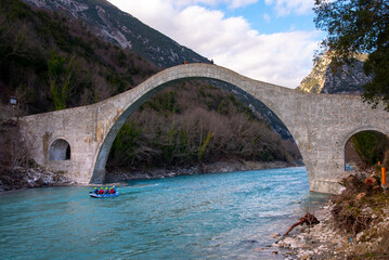The great arched stone bridge of Plaka on Arachthos river, Tzoumerka, Greece.