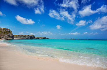 Fototapeta premium Cliffs, reef and turquoise shallows at Mudjin Harbor, Middle Caicos