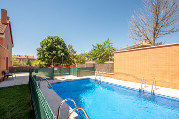 Community pool with fresh water on a sunny summer day
