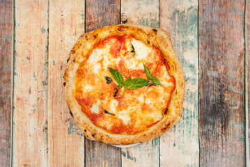 Margarita pizza is a typical Neapolitan pizza made with tomato, mozzarella, fresh basil, salt and oil. It is the most popular Neapolitan pizza, along with the seafood