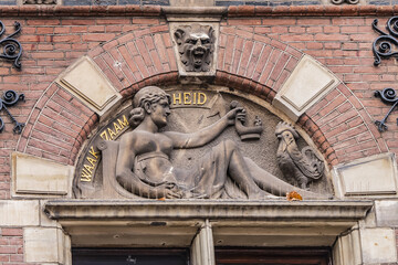 Obraz premium Beautiful architecture of ancient building of The Hague: Department of Justice (Departement van Justitie) on Het Plein. Justice building was built in 1876 - 1880. Den Haag (The Hague). Netherlands.