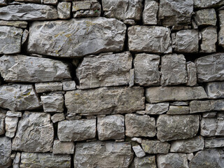 Grey rocky stone wall with texture in lake como, italy