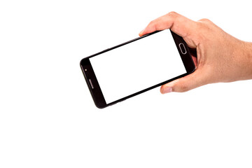 male hand holding cellphone black smartphone in horizontal position filming or photographing something , isolated white background, empty screen for mockup, copy space