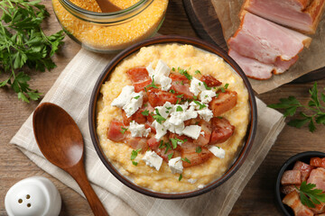 Delicious traditional Ukrainian banosh served on wooden table, flat lay