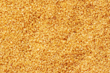 Brown refined sugar top view, texture and background