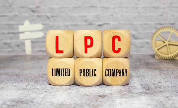 text LPC - Limited Public Company on wooden block