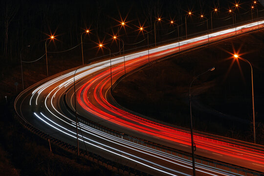 Car traffic on a long exposure, road photography at night, horizontal background for the website and publications in social networks