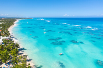 Tropical coastline with resorts, palm trees and caribbean sea. Dominican Republic. Aerial view