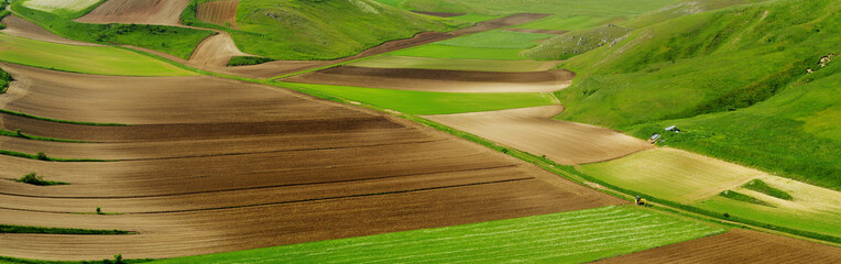 Piano Grande, large karstic plateau of Monti Sibillini mountains and one of the greatest tourist...