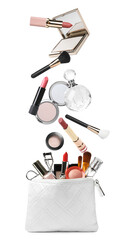 Different makeup products falling into stylish cosmetic bag on white background