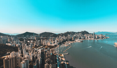 Fototapeta premium Panoramic aerial view of Hong Kong city in Orange and Teal color tone