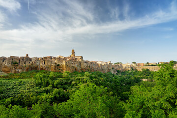 Pitigliano town, located atop a volcanic tufa ridge, known as the little Jerusalem, surrounded by...