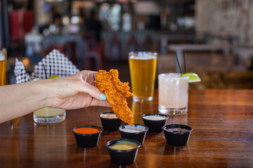 glass of beer on the table chicken tender dipping sauces