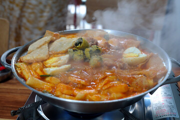 It is a traditional Korean food made with red pepper paste seasoning and rice cake.