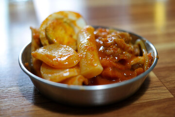 It is a traditional Korean food made with red pepper paste seasoning and rice cake.