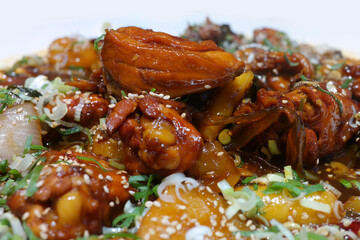 Korean food with soy sauce and steamed chicken.