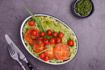 Spicy green mashed potatoes with fried tomatoes