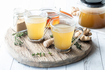 Elixir tea made with thyme, ginger and honey, ready for serving.