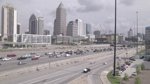Atlanta Georgia Rush Hour Traffic Slow Tracking Shot Over Freeway from R to L.