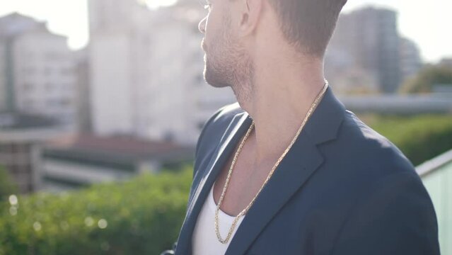 successful guy in a jacket on the background of the city