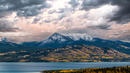 Stunning fall view at the start of winter with snow capped mountains in September with panoramic landscape scenic scene. 