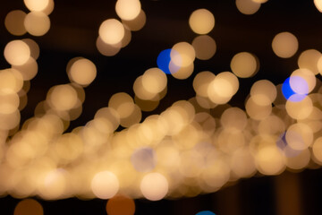 Golden bokeh background, glare of light in the form of circles