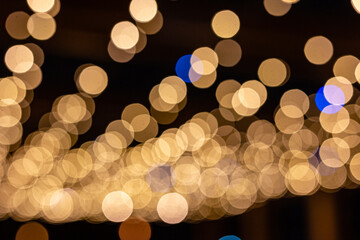 Golden bokeh background, glare of light in the form of circles