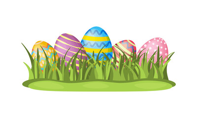 Easter eggs. An illustration of painted Easter eggs lying in the grass on the lawn. Eggs in the green grass. Vector illustration