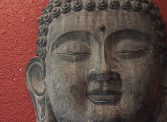 Fototapeta na wymiar Antique Buddha Statue in Temple Close up Face