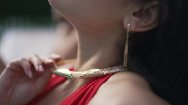 pendant on a girl by the pool