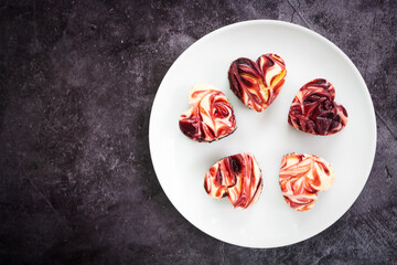 Red velvet brownie cheese cake in heart shape. Sign of Valentine event.